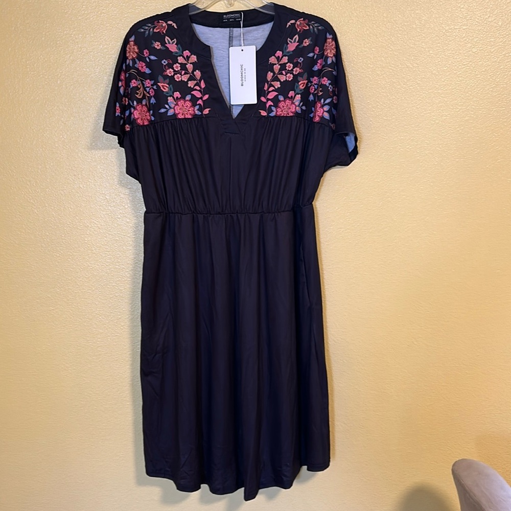 Black dress with printed floral detail